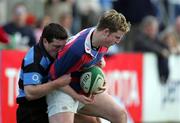 26 March 2005; Dave McAllister, Clontarf, is tackled by Ian Dowling, Shannon. AIB All Ireland League 2004-2005, Division 1, Shannon v Clontarf, Thomond Park, Limerick. Picture credit; Kieran Clancy / SPORTSFILE