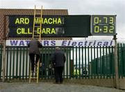 27 March 2005; The scoreboard attendent comes down his ladder after displaying the names of the two teams. Allianz National Football League, Division 1B, Armagh v Kildare, St. Oliver Plunkett Park, Crossmaglen, Co. Armagh.. Picture credit; Brendan Moran / SPORTSFILE