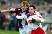 27 March 2005; Martin Penrose, Tyrone, in action against Alan Lambden, Westmeath. Allianz National Football League, Division 1A, Westmeath v Tyrone, Cusack Park, Mullingar, Co. Westmeath. Picture credit; Oliver McVeigh / SPORTSFILE