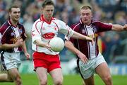 27 March 2005; Mickey Coleman, Tyrone, in action against John Brennan, Westmeath. Allianz National Football League, Division 1A, Westmeath v Tyrone, Cusack Park, Mullingar, Co. Westmeath. Picture credit; Oliver McVeigh / SPORTSFILE
