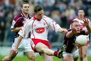 27 March 2005; Mickey Coleman, Tyrone, is blocked down by John Brennan, Westmeath. Allianz National Football League, Division 1A, Westmeath v Tyrone, Cusack Park, Mullingar, Co. Westmeath. Picture credit; Oliver McVeigh / SPORTSFILE