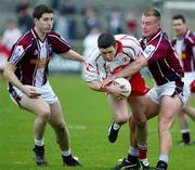 27 March 2005; Sean Cavanagh, Tyrone, is tackled by Daniel Mc Dermott, Westmeath. Allianz National Football League, Division 1A, Westmeath v Tyrone, Cusack Park, Mullingar, Co. Westmeath. Picture credit; Oliver McVeigh / SPORTSFILE