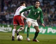 29 March 2005; John O'Shea, Republic of Ireland, in action against Chen Yongqiang, China. International Friendly, Republic of Ireland v China, Lansdowne Road, Dublin Picture credit; Brian Lawless / SPORTSFILE