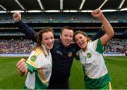 29 September 2013; Offaly's Orla Heavey, left, and Emma Dalton celebrate with manager Greg Farrelly after the game. TG4 All-Ireland Ladies Football Junior Championship Final, Offaly v Wexford, Croke Park, Dublin. Photo by Sportsfile