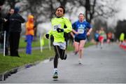 1 January 2014; Jordan Mynes, aged 10, from Cabinteely, Dublin, compeeting in the 2014 Tom Brennan Memorial Trophy 5K Road Race. Phoenix Park, Dublin. Picture credit: Tomás Greally / SPORTSFILE