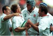 2 October 1999; Matthew Dawson, England's scrum half, celebrates after scoring his sides first try against Italy, with Phil De Glanville and Danny Grewock.1999 Rugby World Cup, England v Italy, Twickenham, London, England. Picture credit: David Maher / SPORTSFILE