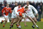27 March 2005; Paul McCormack, Armagh, in action against Ross Glavin, left, and Killian Brennan, Kildare. Allianz National Football League, Division 1B, Armagh v Kildare, St. Oliver Plunkett Park, Crossmaglen, Co. Armagh. Picture credit; Brendan Moran / SPORTSFILE
