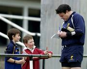 30 March 2005; Leinster captain Reggie Corrigan signs an autograph for some young fans during Leinster Rugby squad training. Old Belvedere, Anglesea Road, Dublin. Picture credit; Brendan Moran / SPORTSFILE