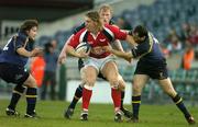 25 March 2005; Andy Powell, Llanelly Scarlets, is tackled by Shane Byrne, left, Leo Cullen and Felipe Contepomi, Leinster. Celtic League 2004-2005, Leinster v Llanelli Scarlets, Lansdowne Road, Dublin. Picture credit; Brendan Moran / SPORTSFILE