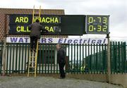 27 March 2005; The scoreboard attendant puts up the names of the teams before the start of the game. The score on the right is the final score of the preceding U-17 international rules game between Ireland and Australia. Allianz National Football League, Division 1B, Armagh v Kildare, St. Oliver Plunkett Park, Crossmaglen, Co. Armagh.. Picture credit; Brendan Moran / SPORTSFILE