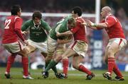 19 March 2005; Eric Miller, Ireland, supported by team-mate Donnacha O'Callaghan, is tackled by Stephen Jones, John Yapp, right, and Gavin Henson, left, Wales. RBS Six Nations Championship 2005, Wales v Ireland, Millennium Stadium, Cardiff, Wales. Picture credit; Brendan Moran / SPORTSFILE