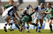 2 April 2005; Mark McHugh, Connacht, is tackled by, from left, Jason White, Mike Hercus and Silico Martens, Sale Sharks. European Challenge Cup 2004-2005, Semi-Final, Connacht v Sale Sharks, Sportsground, Galway. Picture credit; Pat Murphy / SPORTSFILE
