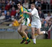 2 April 2005; Ger McCullagh, Meath, is tackled by Mark Scanlon, Kildare. Leinster U21 Football Championship Semi-Final, Meath v Kildare, Cusack Park, Mullingar, Co. Westmeath. Picture credit; Ray McManus / SPORTSFILE