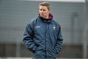 5 January 2014; Westmeath manager Paul Bealin looks on at his players during the pre match warm-up ahead of his first game in charge. Bord na Mona O'Byrne Cup, Group D, Round 1, Westmeath v Dublin, Cusack Park, Mullingar, Co. Westmeath. Picture credit: Barry Cregg / SPORTSFILE