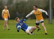 5 January 2014; Niall McDermott, Cavan, in action against Michael McCann, Antrim. Power NI Dr. McKenna Cup, Section C, Round 1, Antrim v Cavan, Creggan Kickhams, Randalstown, Co. Antrim. Photo by Sportsfile