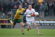 5 January 2014; Ciaran McGinley, Tyrone, in action against Eamonn McGee, Donegal. Power NI Dr. McKenna Cup, Section A, Round 1, Donegal v Tyrone, O'Donnell Park, Letterkenny, Co. Donegal.  Picture credit: Stephen McCarthy / SPORTSFILE