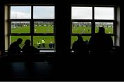 5 January 2014; Spectators watch the game from inside the clubhouse. Power NI Dr. McKenna Cup, Section C, Round 1, Antrim v Cavan, Creggan Kickhams, Randalstown, Co. Antrim. Photo by Sportsfile