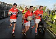 5 January 2014; Cork players Donncha O'Connor, left, Alan Sheehan, centre, and John McLoughlin, right, make their way out for the start of the game. McGrath Cup, Quarter-Final, Cork v Limerick Institute of Technology, Mallow GAA Grounds, Mallow, Co. Cork. Picture credit: Diarmuid Greene / SPORTSFILE