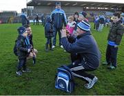 5 January 2014; James Rodgers, age 3, from Ballyboughal, Dublin, has his photograph taken with Dublin goalkeeper Stephen Cluxton by his father Thomas after the game. Bord na Mona O'Byrne Cup, Group D, Round 1, Westmeath v Dublin, Cusack Park, Mullingar, Co. Westmeath. Picture credit: Barry Cregg / SPORTSFILE