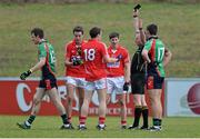 5 January 2014; Michéal O Laoire, Cork, left, is shown a black card by referee Padraig O'Sullivan. O Laoire was not replaced by a team-mate as Cork had used all 6 of their substitutions. McGrath Cup, Quarter-Final, Cork v Limerick Institute of Technology, Mallow GAA Grounds, Mallow, Co. Cork. Picture credit: Diarmuid Greene / SPORTSFILE