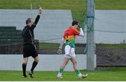 5 January 2014; Barry-John Molloy, Carlow, makes his way off the pitch after being shown a black card by referee Eddie Kinsella. Bord na Mona O'Byrne Cup, Group B, Round 1, Carlow v Longford, Dr. Cullen Park, Carlow. Picture credit: Matt Browne / SPORTSFILE