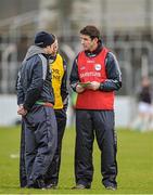 5 January 2014; Carlow manager Anthony Rainbow, right, with selector Damien McMahon and trainer Wayne Middleton convene at half-time after their team had not scored in the first half. Bord na Mona O'Byrne Cup, Group B, Round 1, Carlow v Longford, Dr. Cullen Park, Carlow. Picture credit: Matt Browne / SPORTSFILE