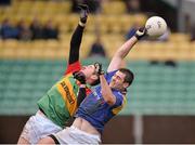 5 January 2014; Kevin Diffley, Longford, in action against Hugh Gahan, Carlow. Bord na Mona O'Byrne Cup, Group B, Round 1, Carlow v Longford, Dr. Cullen Park, Carlow. Picture credit: Matt Browne / SPORTSFILE