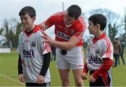 5 January 2014; Cork's Mark Sugrue signs his autograph on the jersey of 11-year-old AJ Whelan, along with his brother Luke Whelan, aged 9, from Donoughmore, Co. Cork, after the game. McGrath Cup, Quarter-Final, Cork v Limerick Institute of Technology, Mallow GAA Grounds, Mallow, Co. Cork. Picture credit: Diarmuid Greene / SPORTSFILE