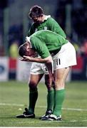 20 October 1999; Ireland's Matt Mostyn, no.11, and Justin Bishop dejected at the final whistle after defeat to Argentina. 1999 Rugby World Cup, Ireland v Argentina, Stade Felix Bollaert, Lens, France. Picture credit: Brendan Moran / SPORTSFILE