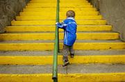 3 April 2005; Three year old Cavan supporter Aoghan Hourican, from Arva, Co. Cavan, makes his way to the stand. Allianz National Football League, Division 2B, Meath v Cavan, Pairc Tailteann, Navan, Co. Meath. Picture credit; Ray McManus / SPORTSFILE