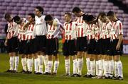 1 April 2005; The Derry City team stands for a minutes silence before the match. Eircom League, Premier Division, Bohemians v Derry City, Dalymount Park, Dublin. Picture credit; Brian Lawless / SPORTSFILE
