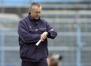 27 March 2005; John Allen, Cork manager, checks the time left in the match. Allianz National Hurling League, Division 1B, Tipperary v Cork, Semple Stadium, Thurles, Co. Tipperary. Picture credit; Damien Eagers / SPORTSFILE