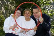 6 April 2005; Special Olympics Athlete Anne Foley, left, star of the new Special Olympics advertising campaign with Special Olympics Ireland board member Rita Lawlor and David McRedmond, eircom, get into the spirit of things at the launch of Get Up, Get Out, and GO - a major fundraising and recruitment drive for Special Olympics Ireland to help recruit 8,000 new athletes by 2007. Iveagh Gardens, Harcourt St., Dublin. Picture credit; Ray McManus / SPORTSFILE