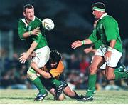 31 May 1999; David Corkery, Ireland, gets the ball away to Dion O'Cuinneagain despite the tackle of Julian Moreton, New South Wales Country. 1999 Australia Tour, New South Wales Country Cockatoos v Ireland, Woy Woy Oval, New South Wales, Australia. Picture credit: Matt Browne / SPORTSFILE