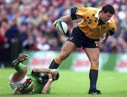 10 October 1999; Matt Burke, Australia, is tackled by Tom Tierney, Ireland. 1999 Rugby World Cup, Ireland v Australia, Lansdowne Road, Dublin. Picture credit: Matt Browne / SPORTSFILE
