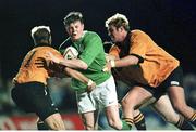 31 May 1999; Brian O'Driscoll, Ireland, is tackled by Lincoln Job (no.11, left) and Scott Fava, NSW Country. 1999 Australia Tour, New South Wales Country Cockatoos v Ireland, Woy Woy Oval, New South Wales, Australia. Picture credit: Matt Browne / SPORTSFILE