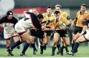 14 October 1999; Jason Little, Australia, is tackled by Luke Gross, USA. 1999 Rugby World Cup, Australia v USA, Thomond Park, Limerick. Picture credit: Matt Browne / SPORTSFILE