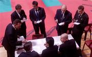 8 April 2005; Judges discuss a decision during the Junior Mens Pattern Section, European Taekwon-Do Championships. National Basketball Arena, Tallaght, Dublin. Picture credit; Damien Eagers / SPORTSFILE