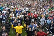 9 April 2005; Competitors take part in an organised warm up session prior to start of the BUPA Great Ireland Run. Phoenix Park, Dublin. Picture credit; Brian Lawless / SPORTSFILE