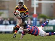 9 April 2005; Niall Ronan, Lansdowne, escapes the tackle of Shane Moore, Clontarf. AIB All Ireland League 2004-2005, Division 1, Clontarf v Lansdowne, Castle Avenue, Dublin. Picture credit; Matt Browne / SPORTSFILE