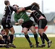 10 April 2005; Ray Hogan, Connacht, is tackled by no. 9 Jason Spice and Adam Jones, The Ospreys. Celtic League 2004-2005, Pool 1, Connacht v Neath-Swansea Ospreys, Sportsground, Galway. Picture credit; David Maher / SPORTSFILE