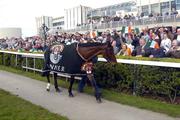 10 April 2005; Hedgehunter the winner of the Grand National yesterday is paraded to the crowd by Mia Niemela. Leopardstown Racecourse, Dublin. Picture credit; Damien Eagers / SPORTSFILE