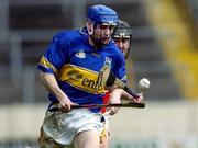 10 April 2005; Philip Austin, Tipperary, in action against David Foley, Cork. Vocational Schools GAA Inter-County 'A' Hurling Final. Tipperary v Cork, Semple Stadium, Thurles, Co. Tipperary. Picture credit; Ray McManus / SPORTSFILE