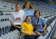 11 April 2005; Dublin camogie players Anne McCluskey, and Eimear Brannigan, right, with Kildare player Ciara Tallon, left, and Special Olympics Athlete Aine Lawlor, from Marino, Dublin, at the announcement that Special Olympics Ireland are to be the Camogie Association's nominated charity for 2005. Croke Park, Dublin. Picture credit; Ray McManus / SPORTSFILE