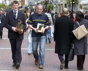 11 April 2005; Clare hurler Niall Gilligan, left, who was presented with the Vodafone Player of the Month award for the month of March for Hurling and Tyrone footballer Stephen O'Neill who was presented with the Vodafone Player of the Month award for the month of March for Football, walk up Grafton Street before the award ceremony. Westbury Hotel, Dublin. Picture credit; Pat Murphy / SPORTSFILE