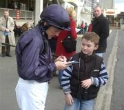 10 April 2005; Jockey Kieran Fallon signs an autograph before the Dimitrova 1,000 Guineas Trial Stakes. Leopardstown Racecourse, Dublin. Picture credit; Damien Eagers / SPORTSFILE