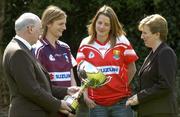 13 April 2005; Galway captain Annette Clarke, left and Cork captain Juliet Murphy with Niall O'Gorman, General Manager Suzuki Ireland and Geraldine Giles, President of the Ladies Football Association, in conversation while holding the Ladies National Football League cup at a photocall ahead of the Suzuki Ladies National Football League Final. Merrion Square, Dublin. Picture credit; Pat Murphy / SPORTSFILE