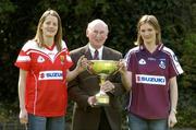 13 April 2005; Cork captain Juliet Murphy, left and Galway captain Annette Clarke with Niall O'Gorman, General Manager Suzuki Ireland, at a photocall ahead of the Suzuki Ladies National Football League Final. Merrion Square, Dublin. Picture credit; Pat Murphy / SPORTSFILE
