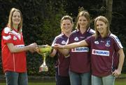 13 April 2005; Cork captain Juliet Murphy tries to pull the Ladies National Football League trophy from Galway's from left, Deirdre Heverin, Annette Clarke, captain, and Maire O'Connell at a photocall ahead of the Suzuki Ladies National Football League Final. Merrion Square, Dublin. Picture credit; Pat Murphy / SPORTSFILE