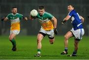 8 January 2014; Ruairi Allen, Offaly, in action against Billy Sheehan, Laois. Bord na Mona O'Byrne Cup, Group A, Round 2, Laois v Offaly, O'Moore Park, Portlaoise, Co. Laois. Picture credit: Ramsey Cardy / SPORTSFILE